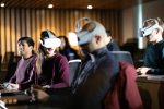 A group of students wearing a virtual reality headsets